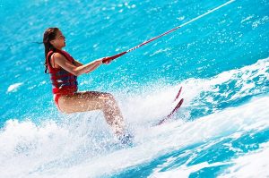 Portrait of a beautiful young woman water skiing